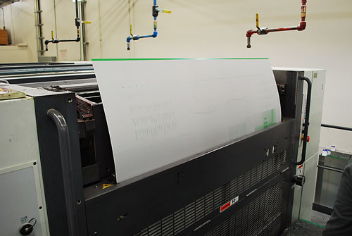 A printing plate being inserted into one of the towers.